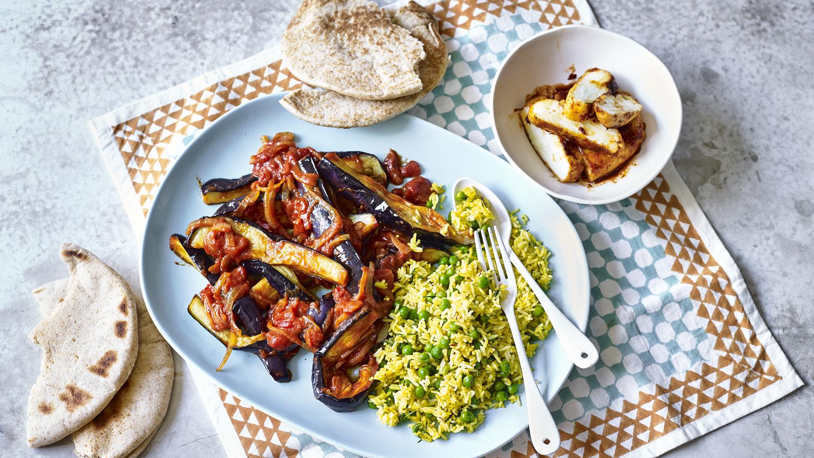 Aubergines in tamarind sauce with baked halloumi and saffron rice